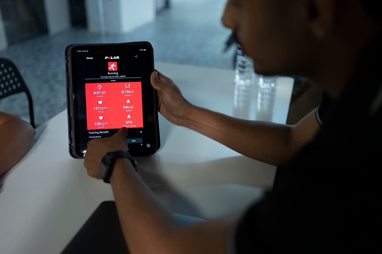 Polar app on iPad showing 121bpm average heart rate, 0.72km, 54kcal — real session data from a FIT360 client