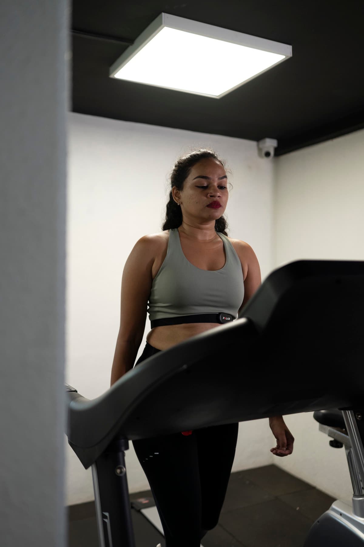A woman strength training in the FIT360 private studio with her trainer